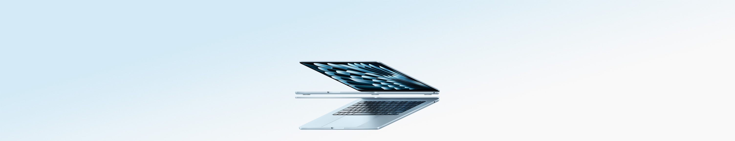 Two open MacBook Air laptops in sky blue color forming arrow shape